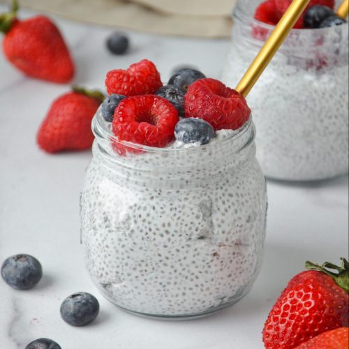 chia pudding with berries in a mason jar