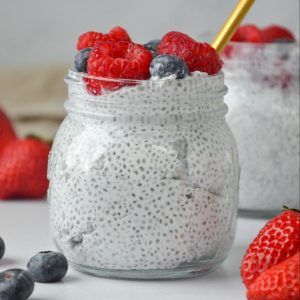 chia pudding with berries in a mason jar