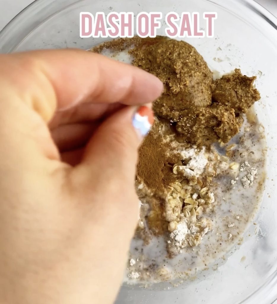 adding salt to a bowl