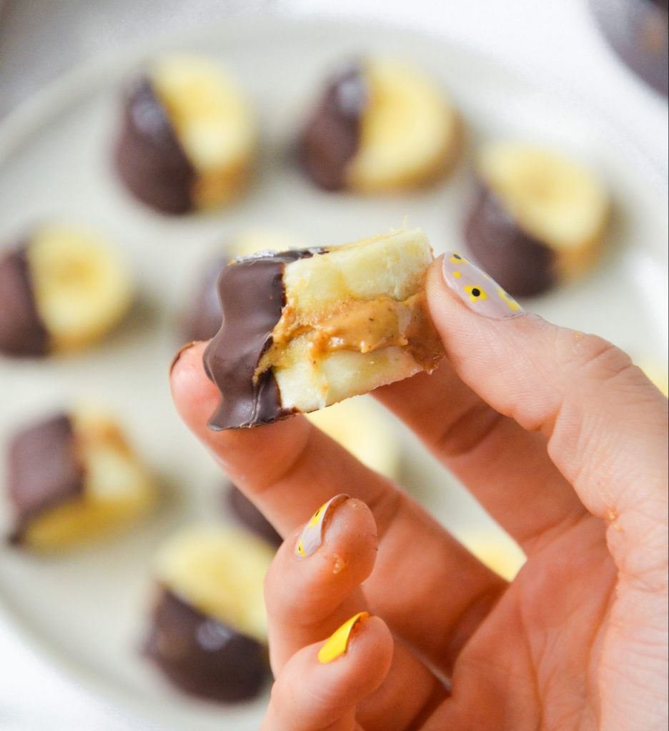 banana bite with peanut butter in the middle and chocolate on the outside