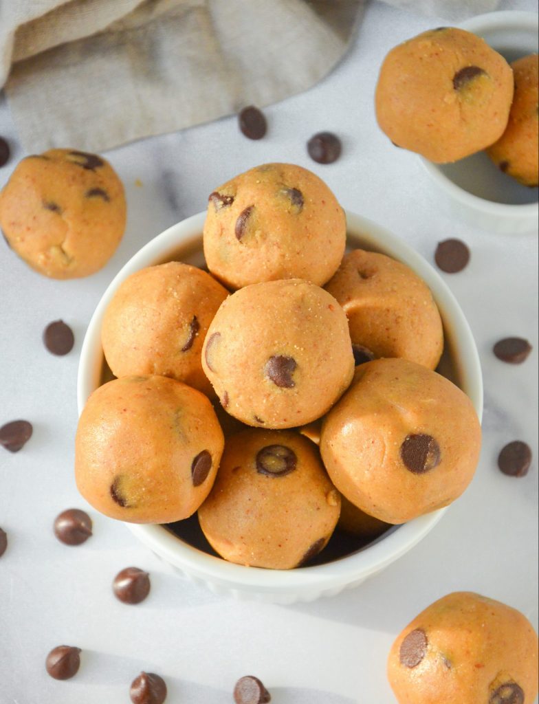 a bowl of chocolate chip cookie dough bites