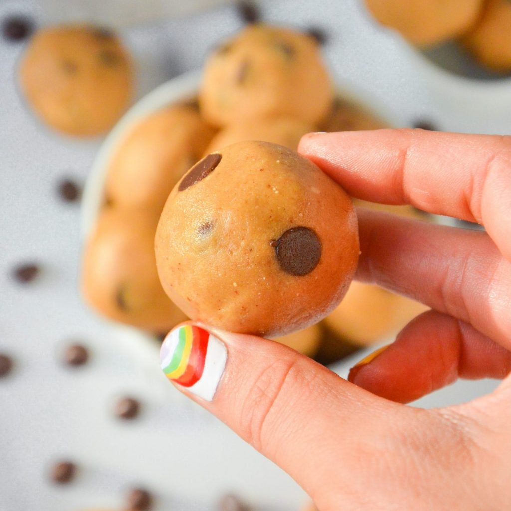 hand holding chocolate chip cookie dough truffle
