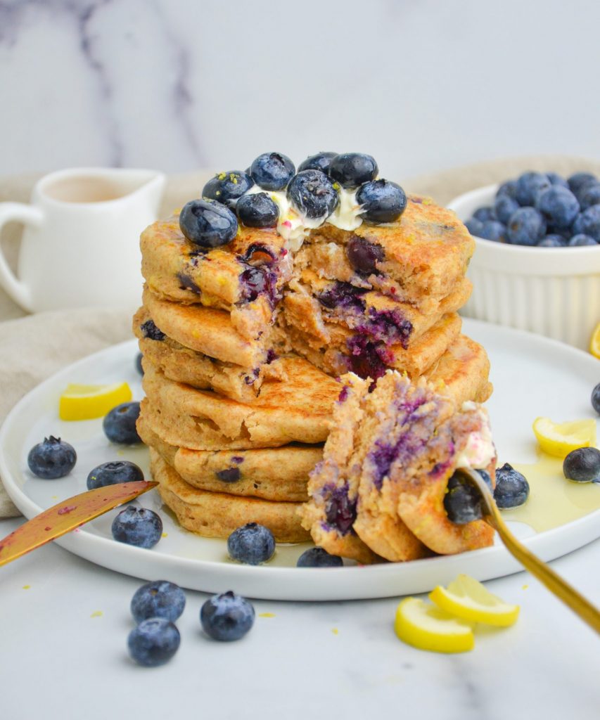 blueberry pancakes on a plate that are cut into