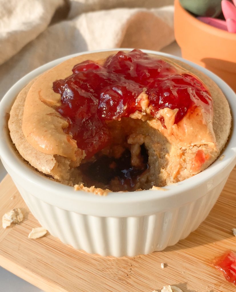 closeup shot of a bowl of peanut butter and jelly baked oats