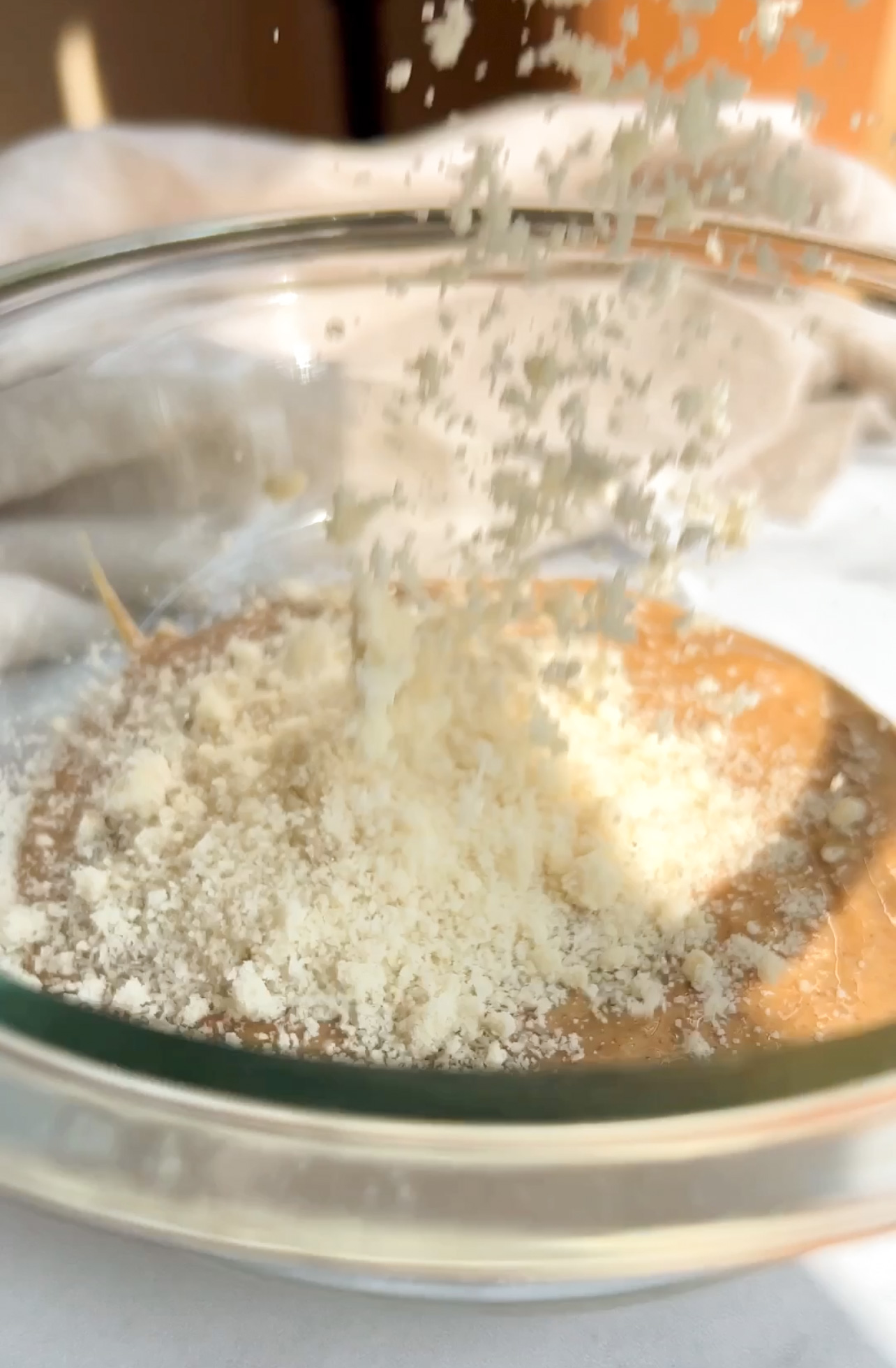 almond flour being poured to bowl
