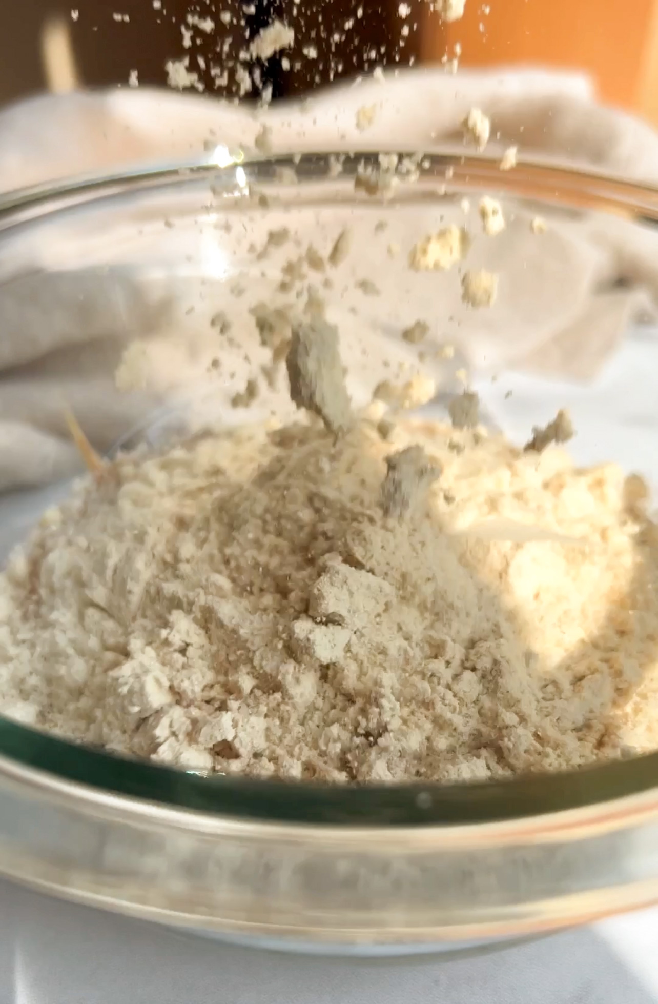 protein powder being added to bowl