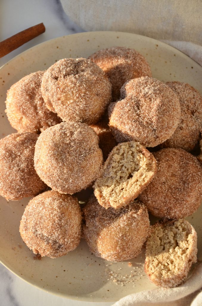 cinnamon sugar donut holes overhead on a plate