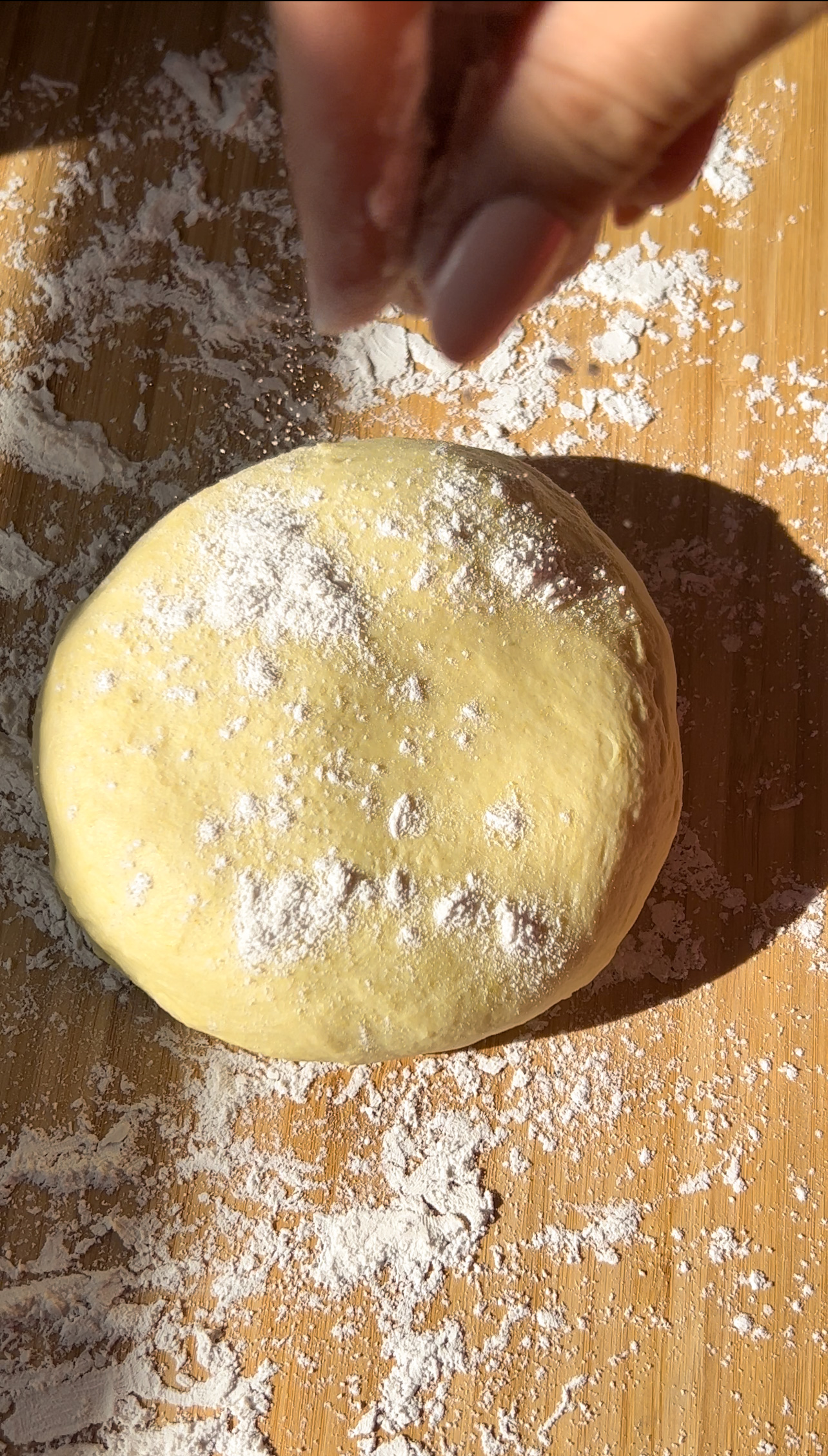 dusting flour on fresh pasta dough