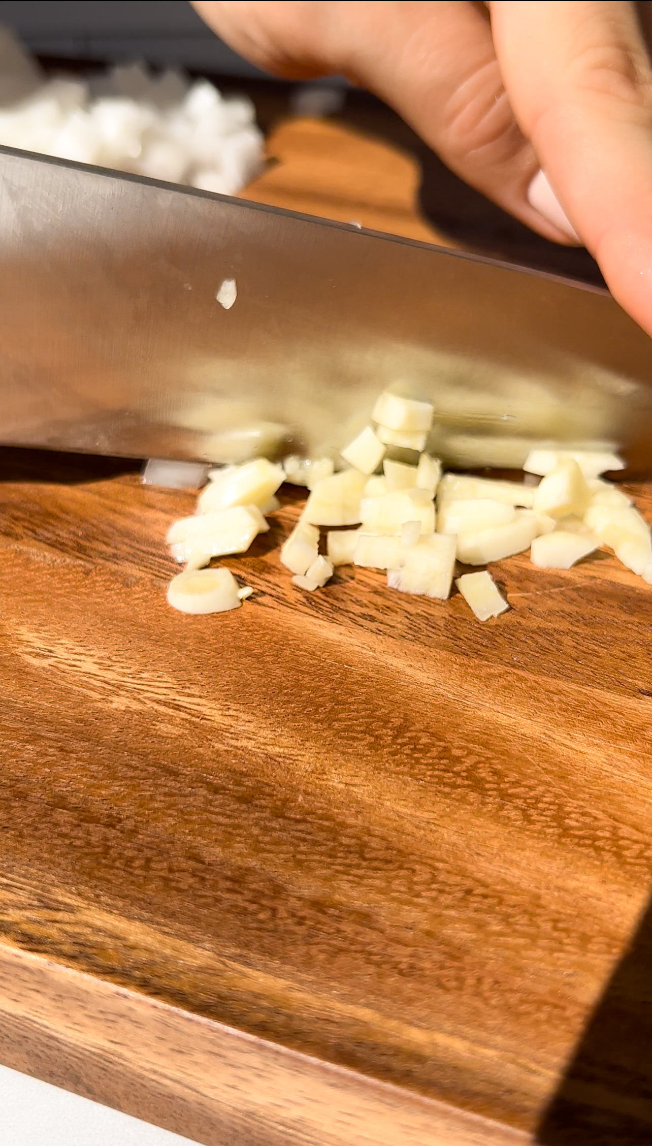knife mincing garlic