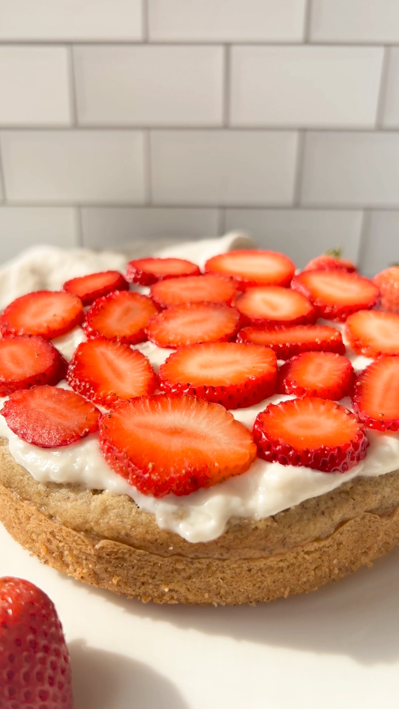 strawberries on top of a cake layer