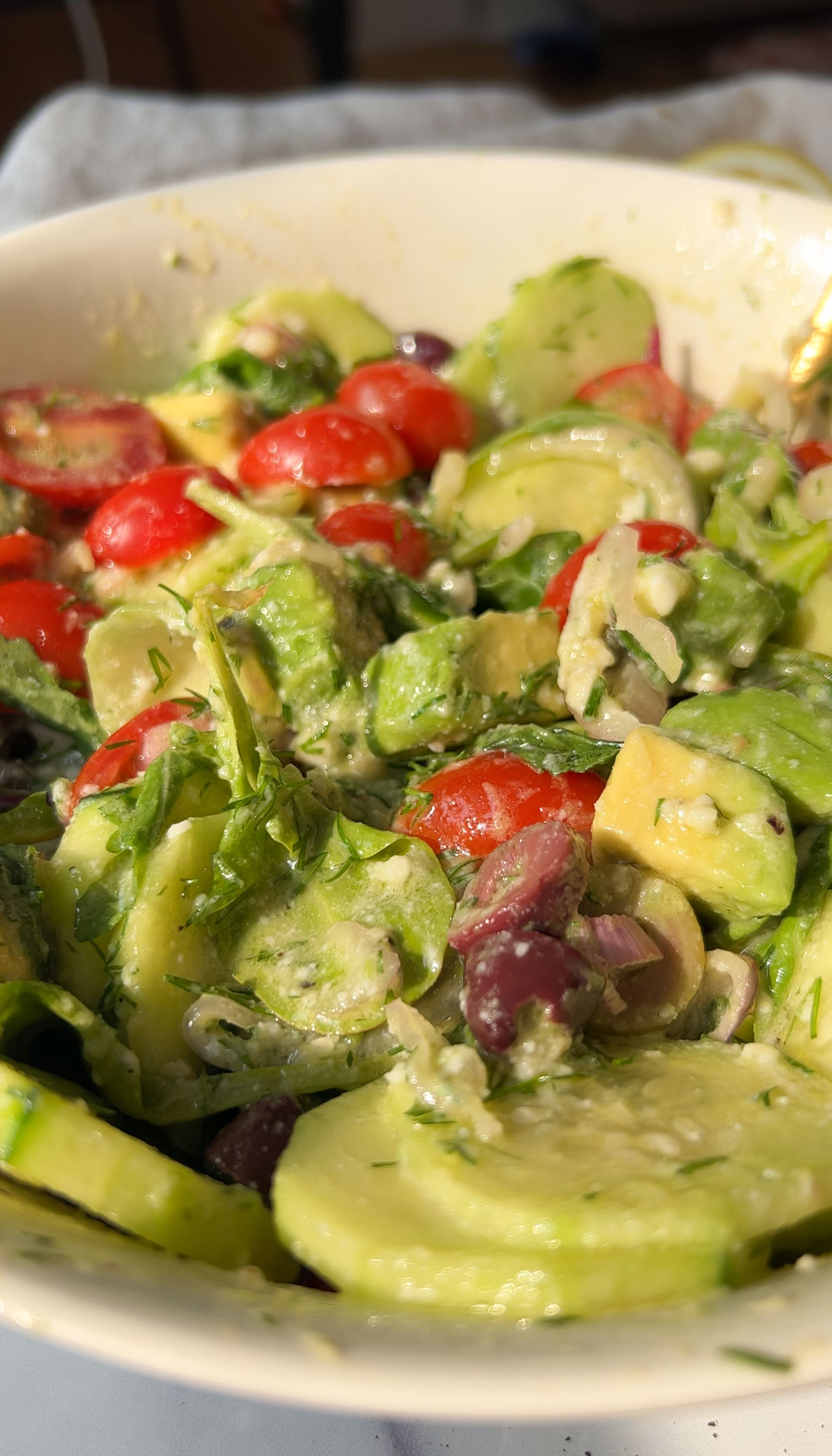 A close up of vegan greek salad in a bowl.