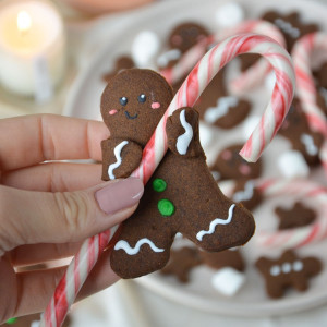 vegan gingerbread cookie recipe holding a candy cane