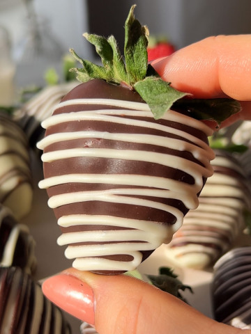 a closeup of a vegan chocolate covered strawberry