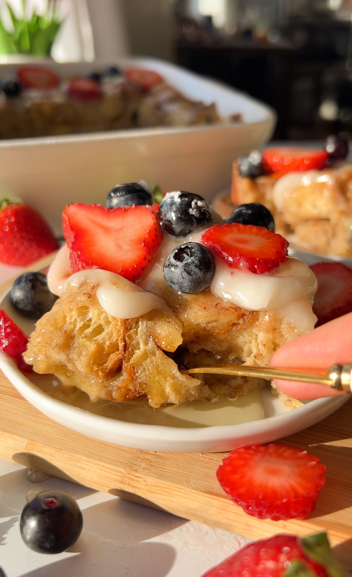 slicing into a piece of vegan french toast casserole