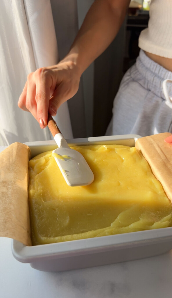 leveling out the top of a lemon bar filling recipe before baking