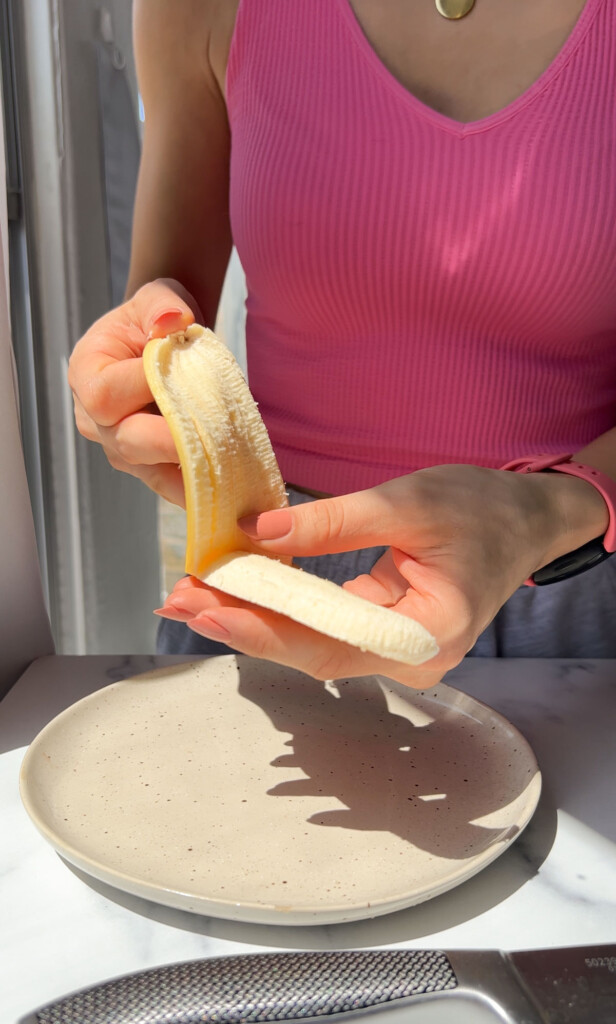 removing the peel from a halved banana
