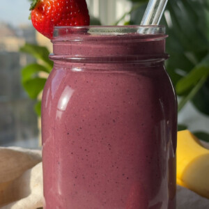 An acai smoothie in a glass.