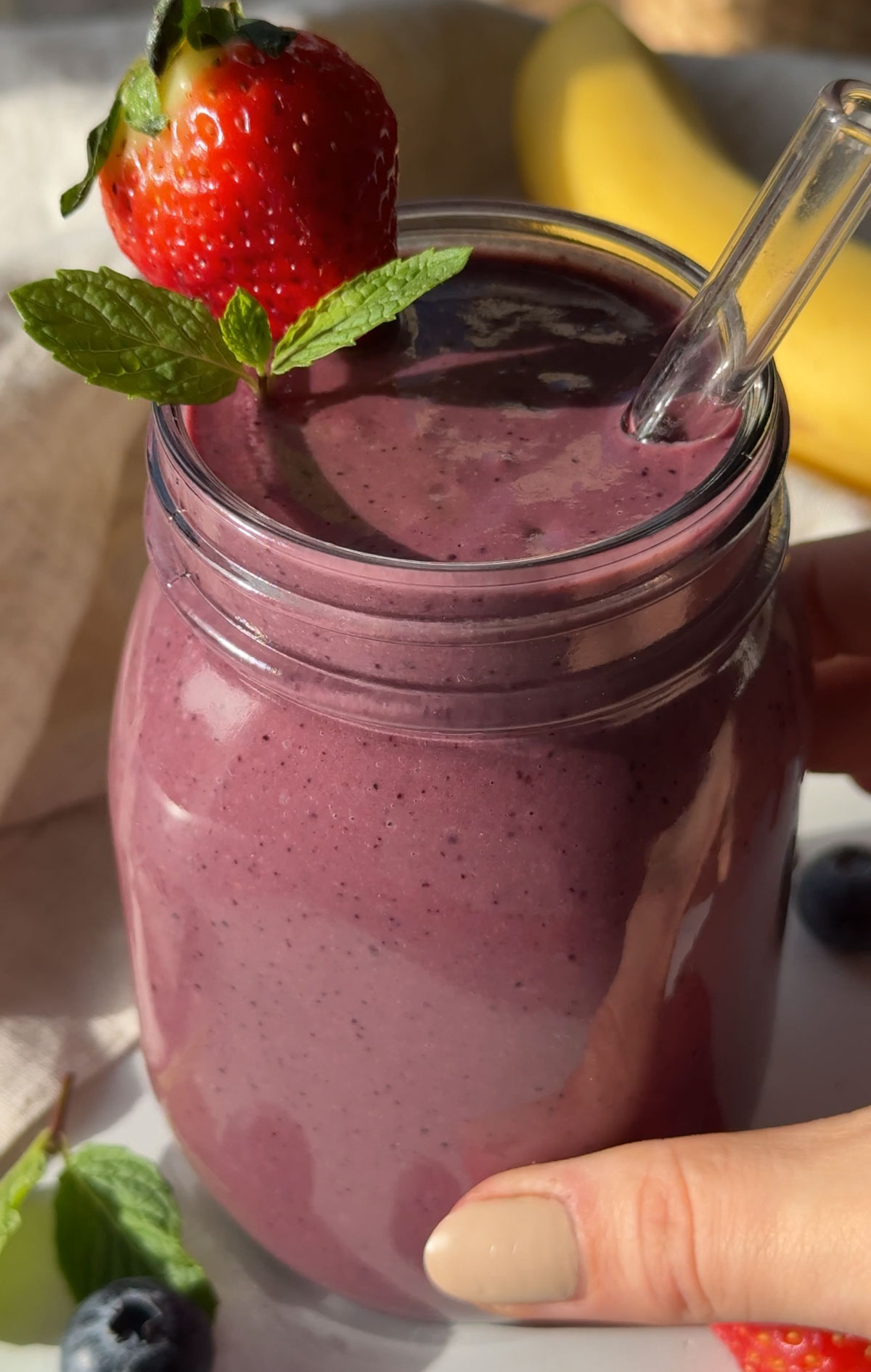 An acai smoothie in a glass.