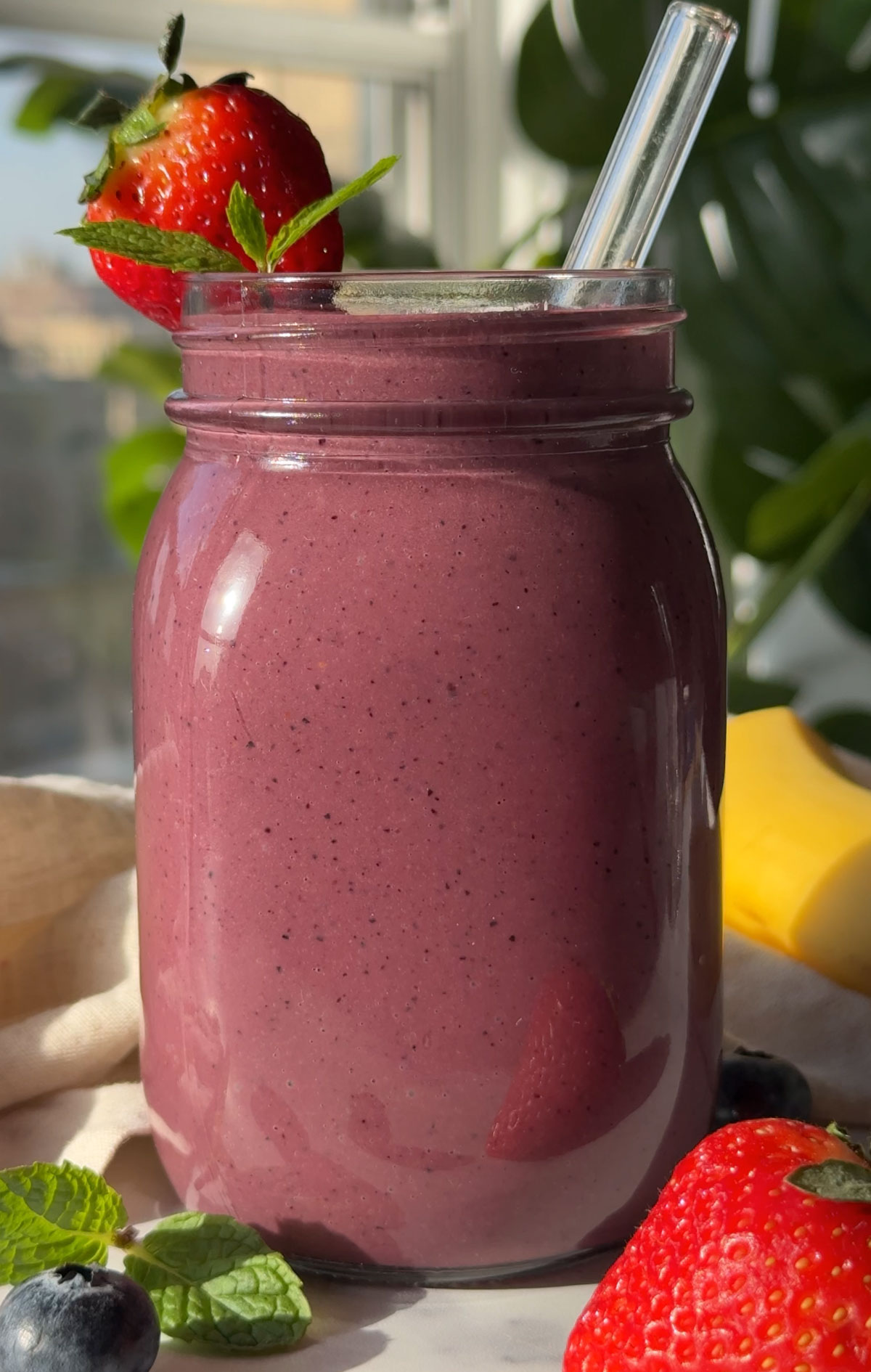 An acai smoothie in a glass.