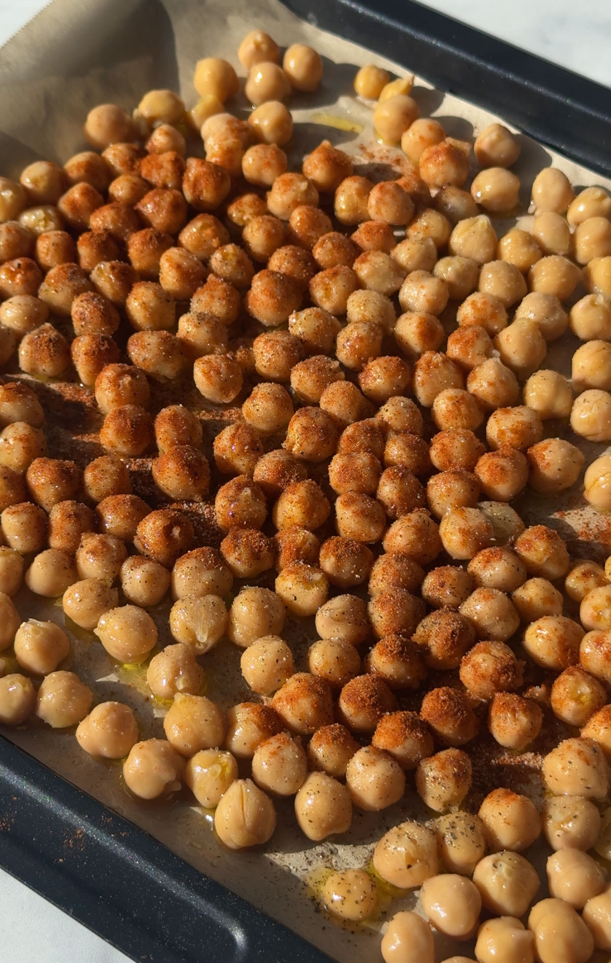Chickpeas in a roasting pan.