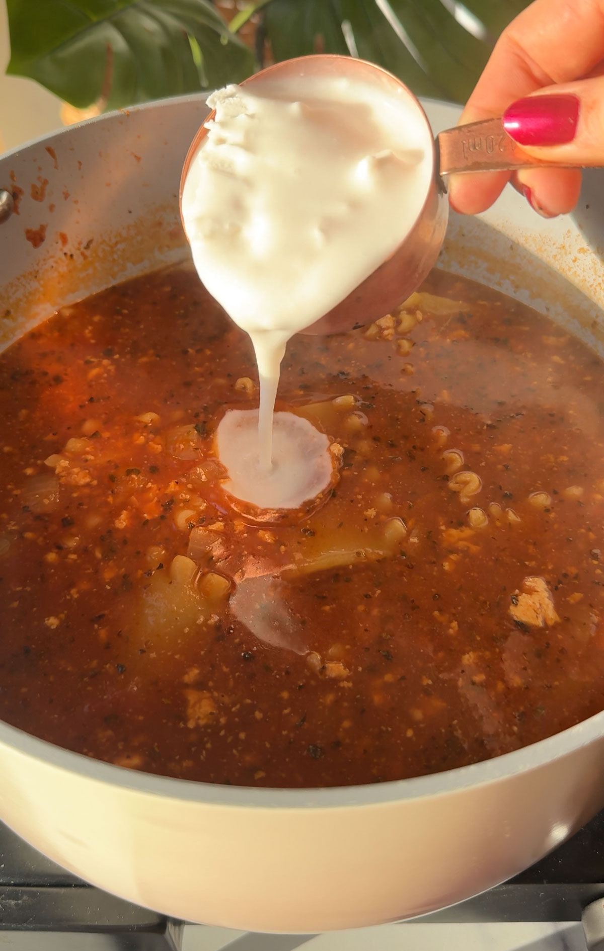 Cream being added to the soup.