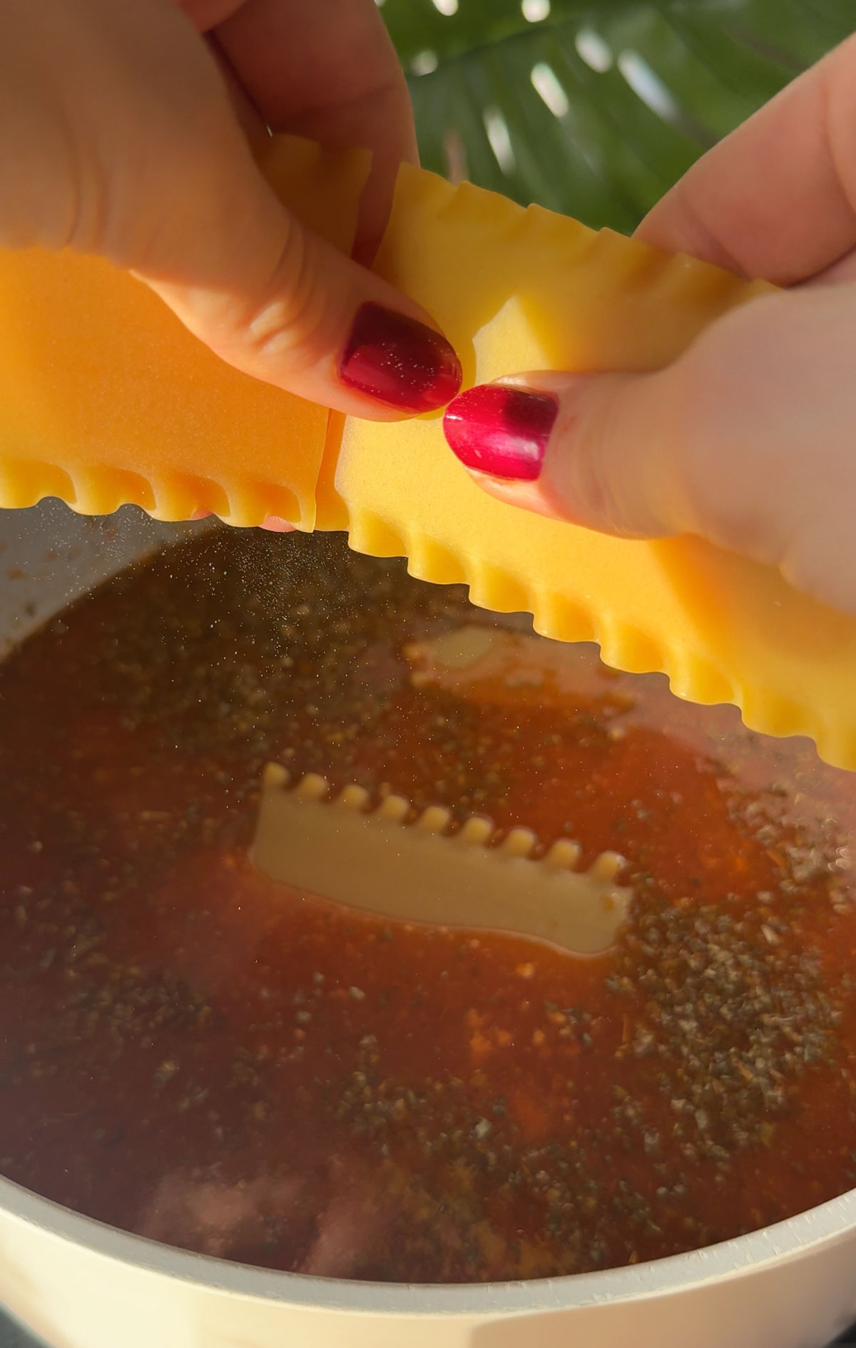 Noodles being added to the soup.