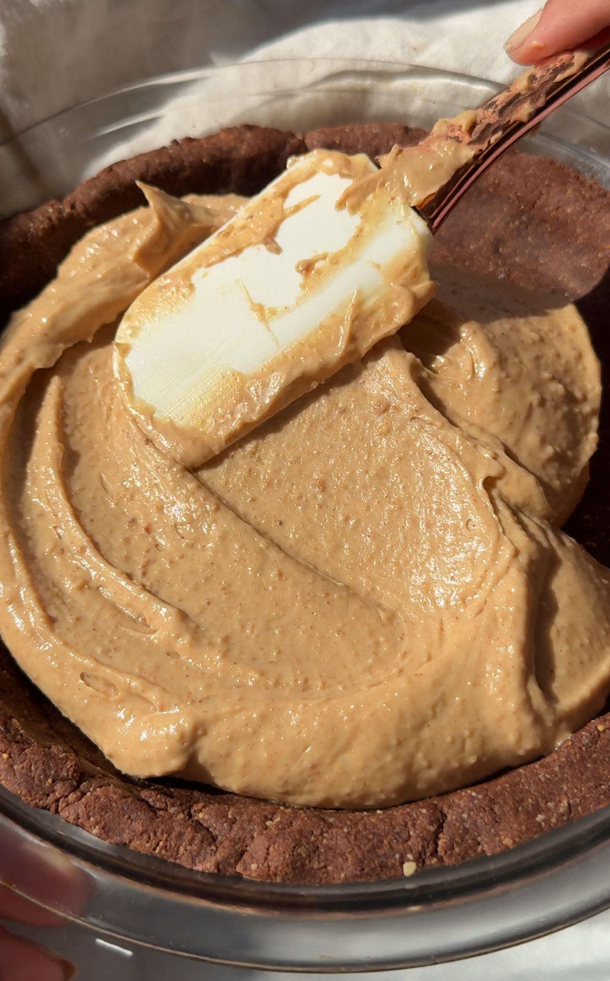 Peanut butter pie filling spread on the crust.