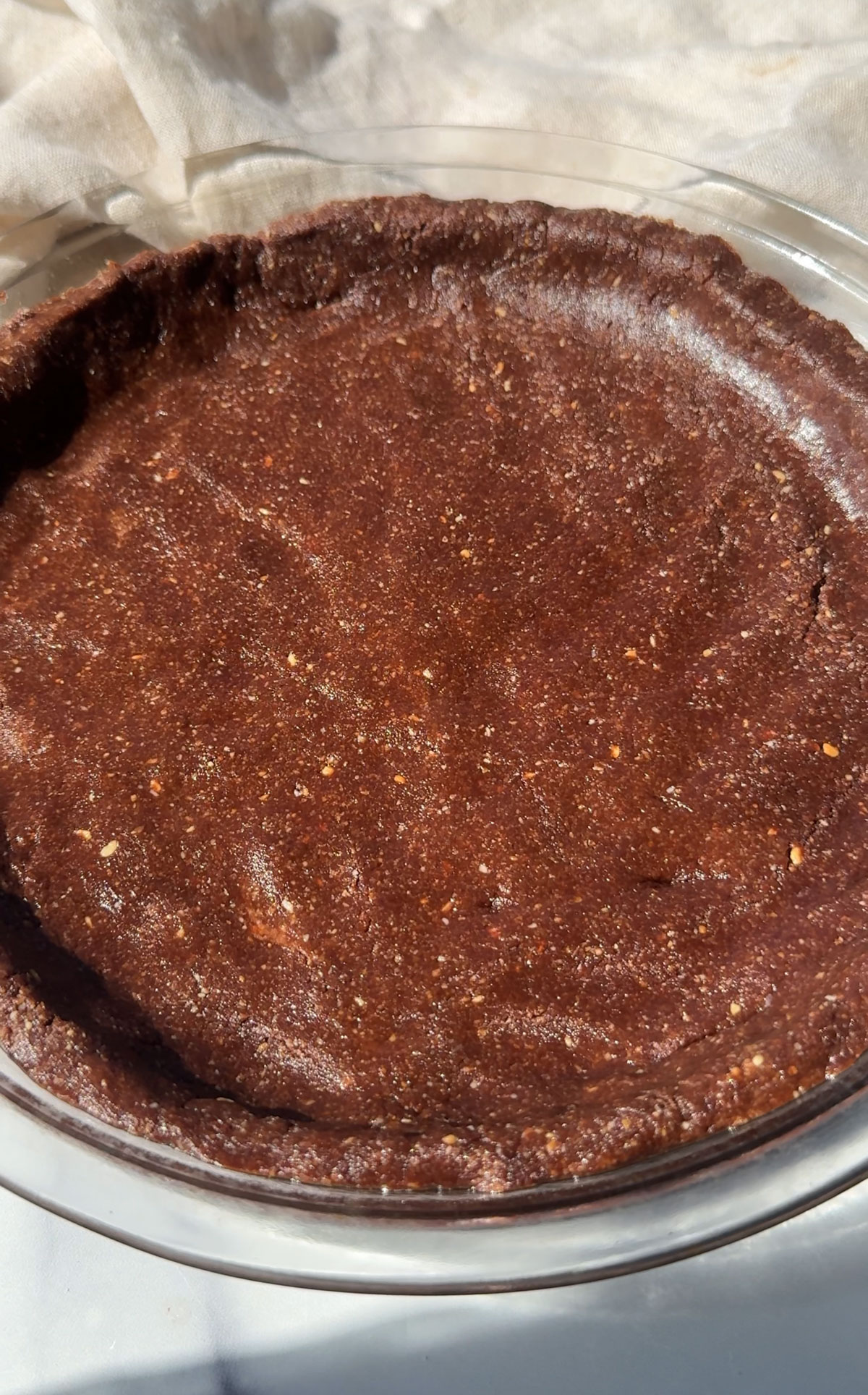 Pie crust in a pie pan.