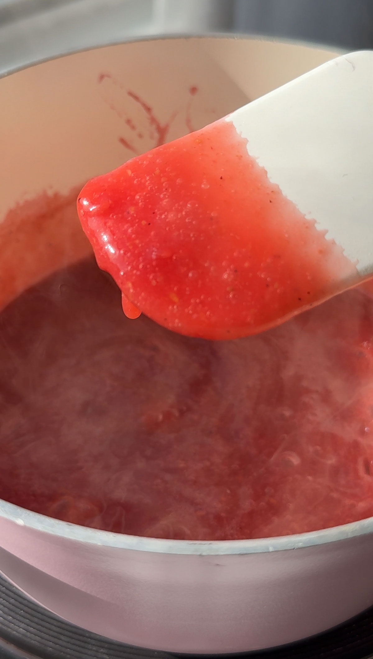 Vegan gummy candy mixture on a spatula.