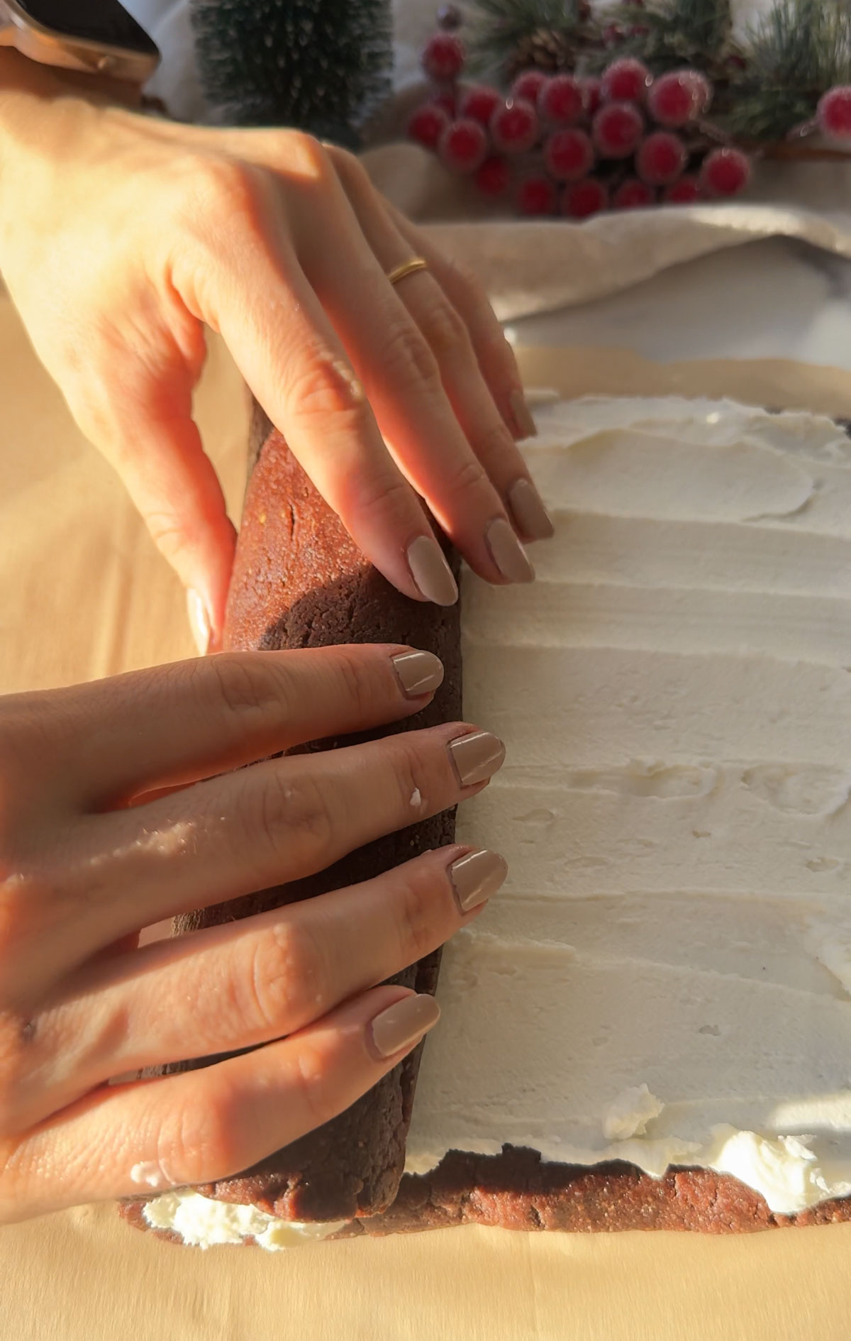 Hands rolling the yule log.