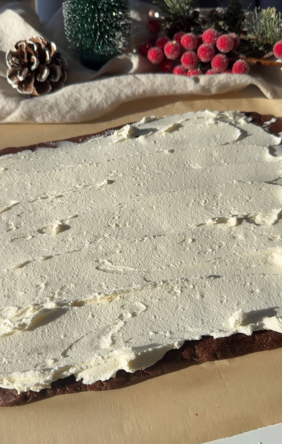 Yule log filling spread onto the dough.