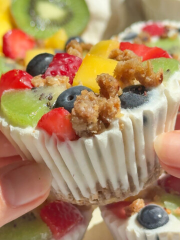 Hands holding up a frozen yogurt cup.