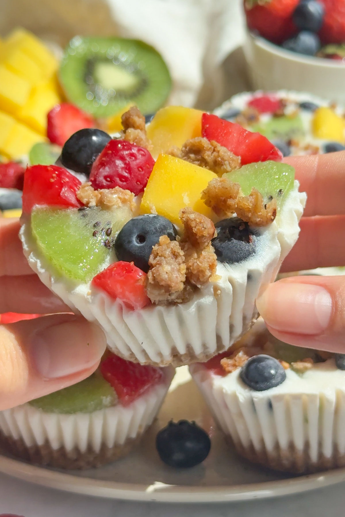 A hand holding up a frozen yogurt cup.