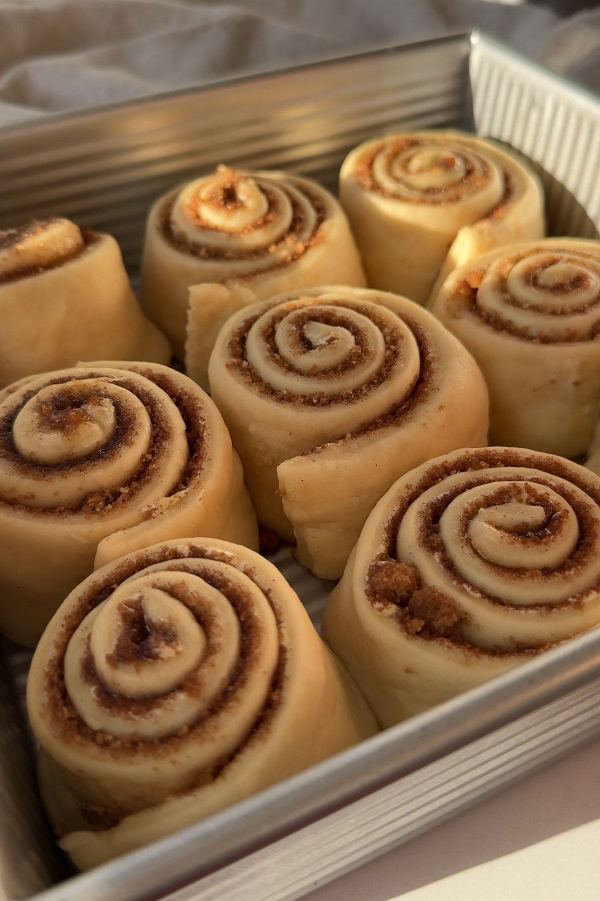 Cinnamon rolls baked in a pan.