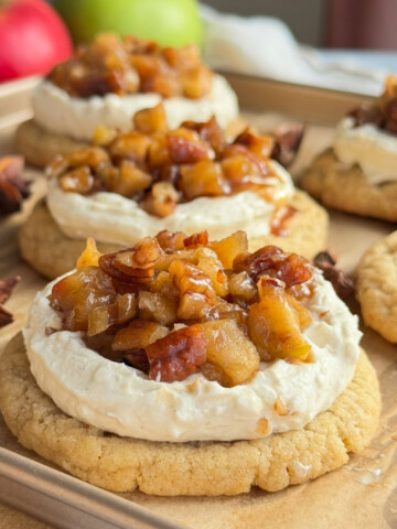 Apple cheesecake cookies on a baking sheet.