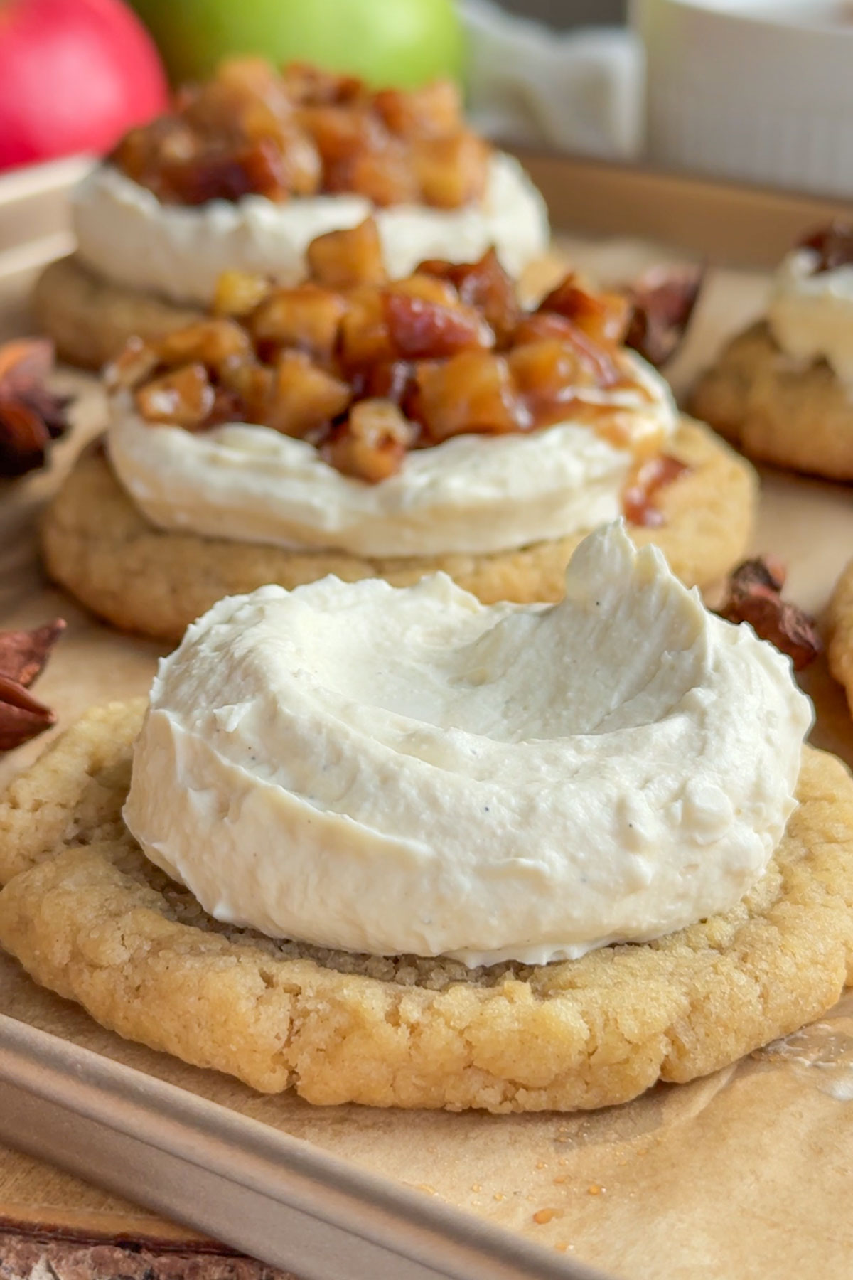 The cookies baked and cream spread over the cookie.