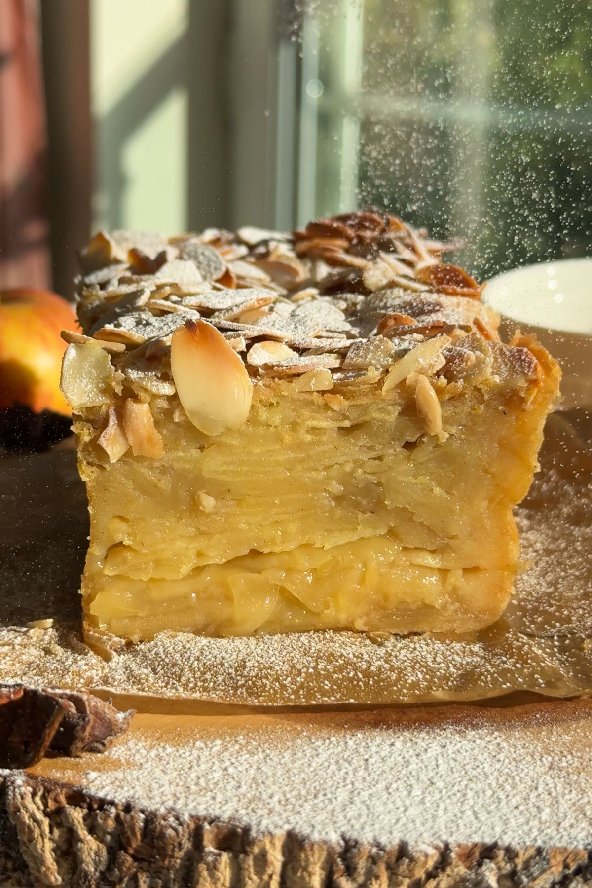 Powdered sugar added on top of the invisible apple cake.