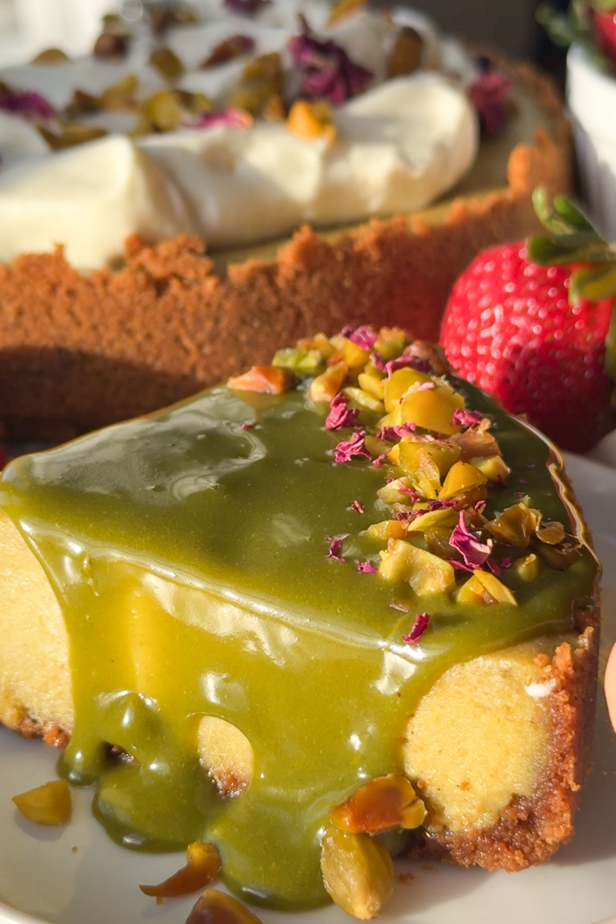 A slice of pistachio cheesecake on a plate.