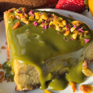 Pistachio cheesecake on a plate.