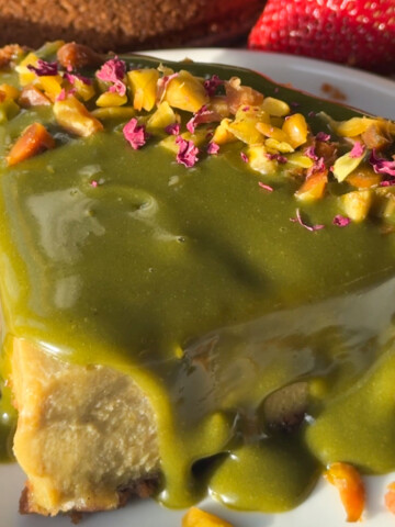 Pistachio cheesecake on a plate.