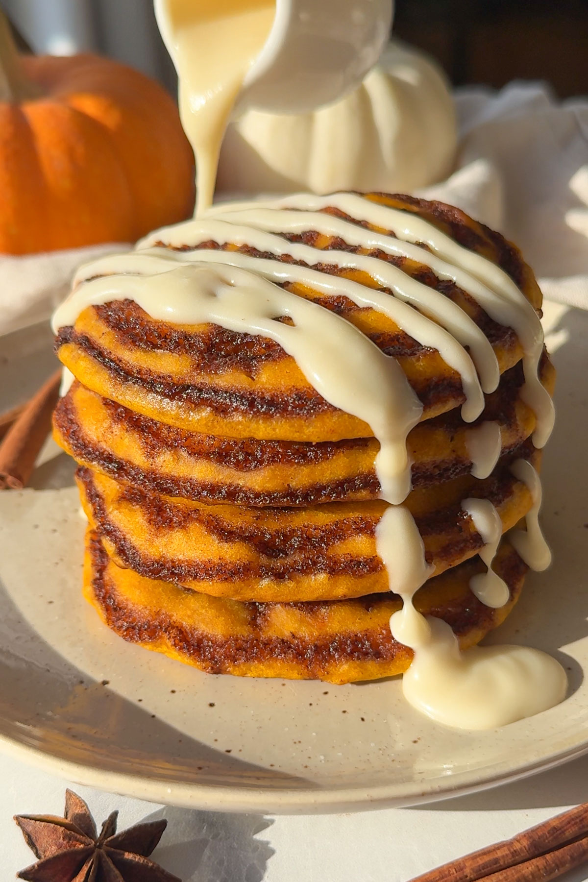 The icing drizzled on top of the cooked pancakes.