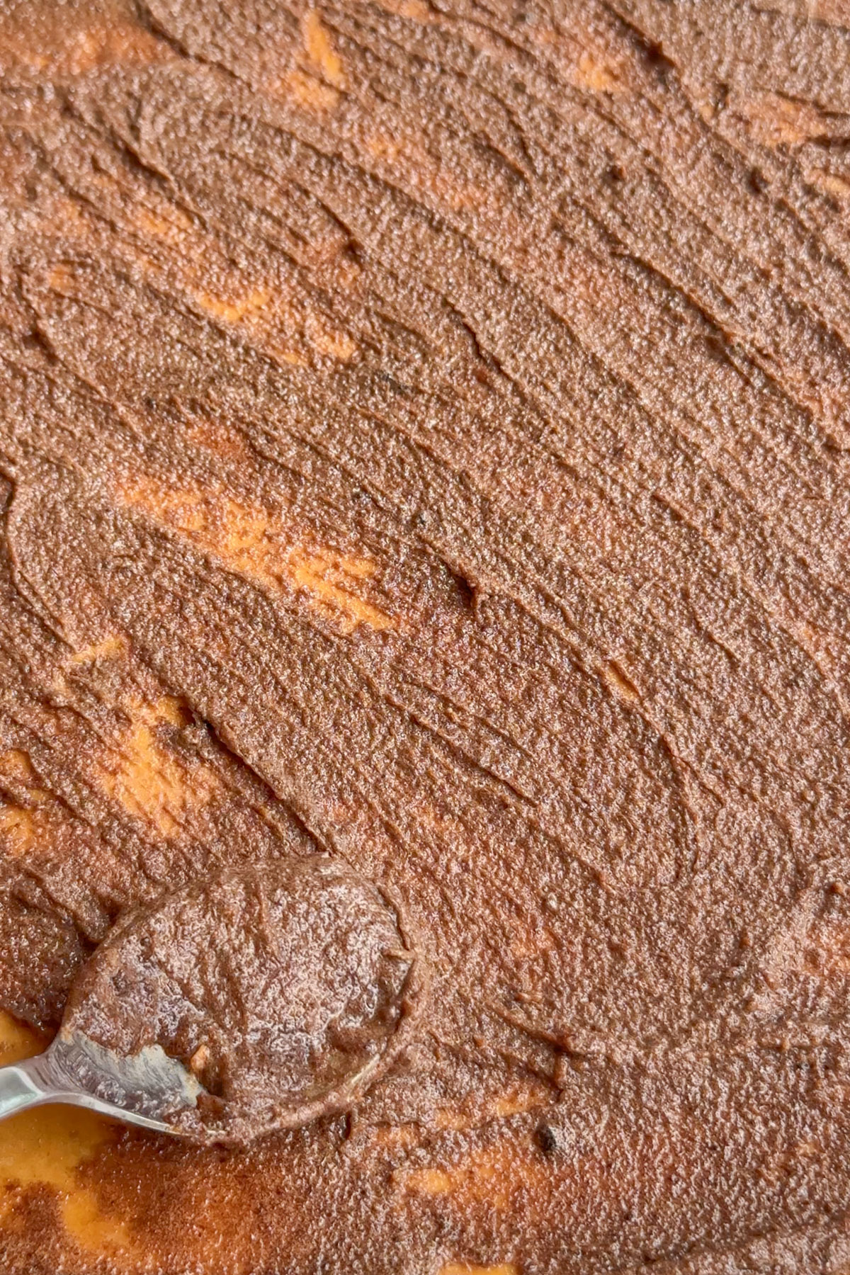 Cinnamon mixture spread on the dough.