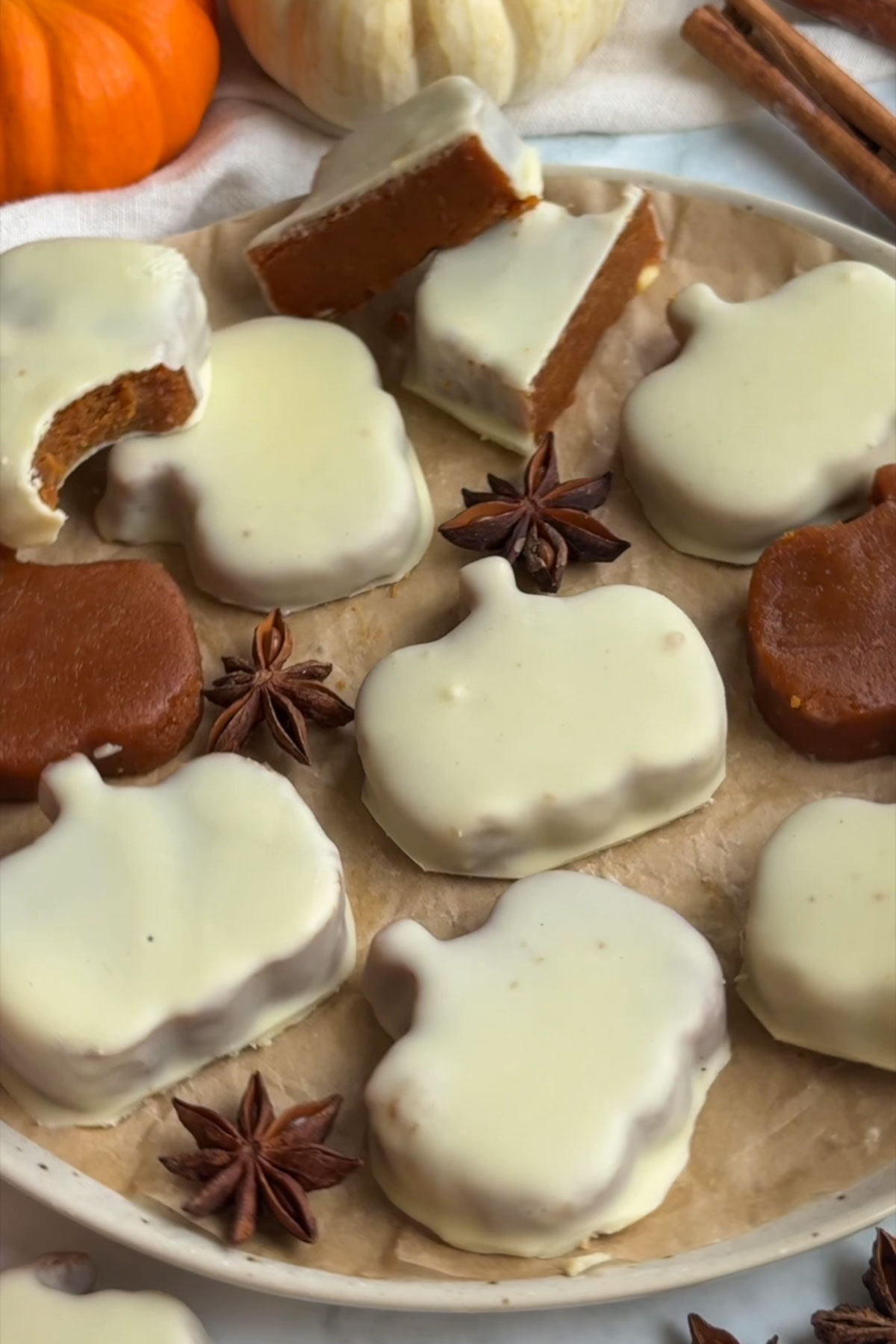 Pumpkin peanut butter cups on a plate.