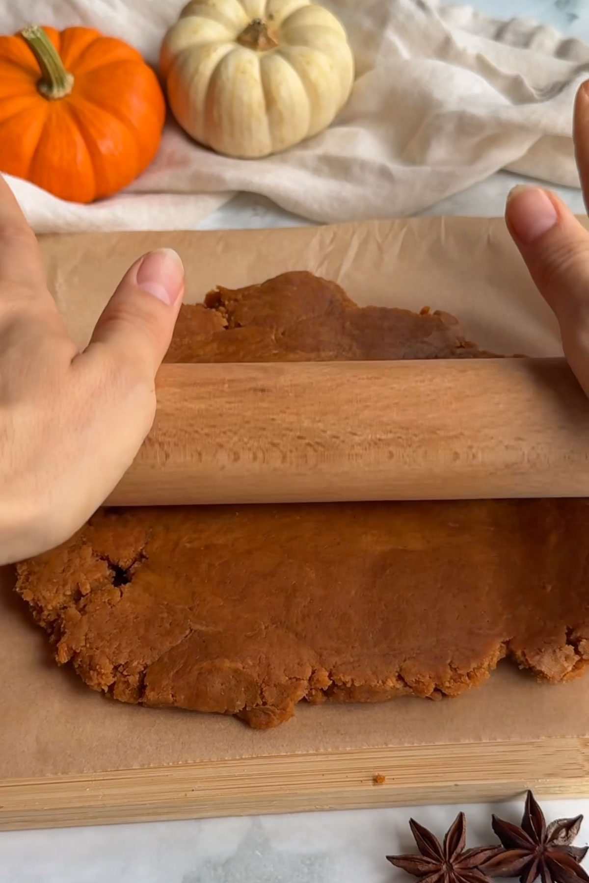 The dough rolled out on a board.