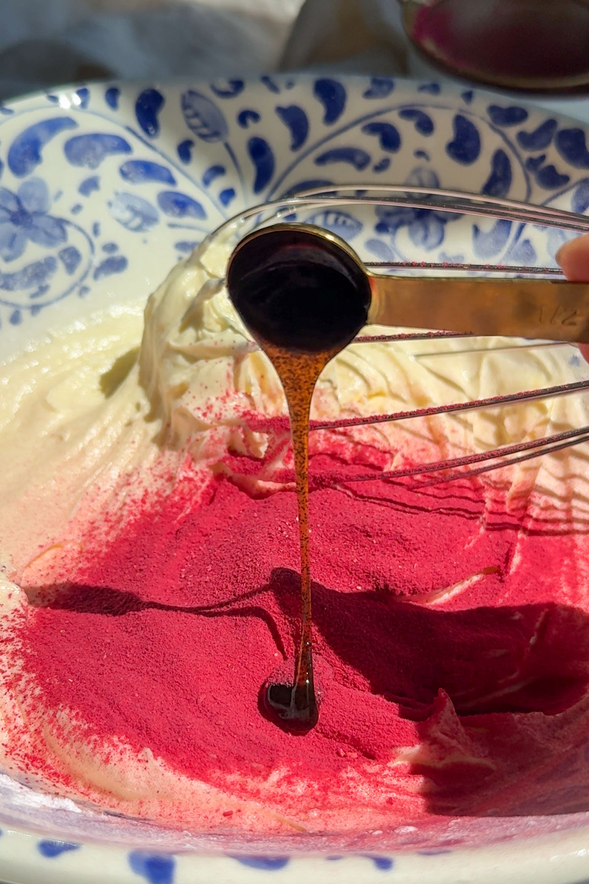 Whip cream being made with raspberry powder.