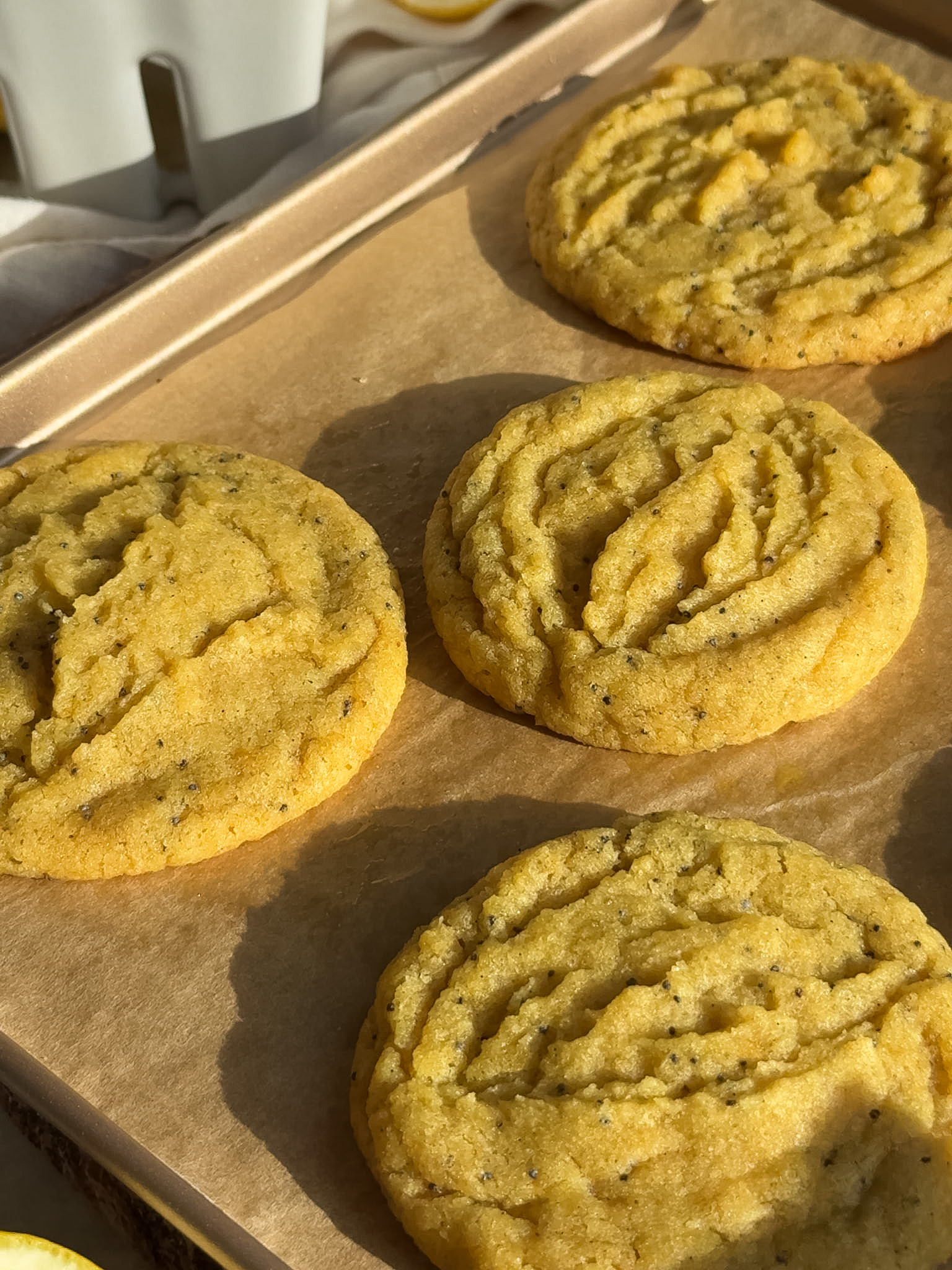Baked cookies cooling on a baking pan.